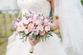 Wedding bouquet of lavender, roses and peonies.