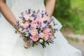 Wedding bouquet of lavender, roses and peonies.