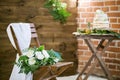 Wedding bouquet lying on wooden chair for wedding ceremony Royalty Free Stock Photo