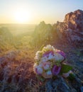Wedding bouquet near a hill at sunset Royalty Free Stock Photo