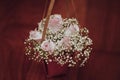 Wedding bouquet of paniculate and roses with wood background