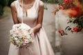 Wedding bouquet of pink roses and white flowers. bride holding i Royalty Free Stock Photo