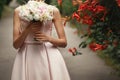 Wedding bouquet of pink roses and white flowers. bride holding i Royalty Free Stock Photo