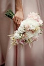 Wedding bouquet of pink roses and white flowers. bride holding i Royalty Free Stock Photo