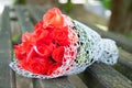 Wedding bouquet of red roses lies on the bench. Fragrant flowers, smell beautiful Royalty Free Stock Photo