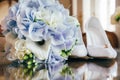 Wedding bouquet, rings and shoes Royalty Free Stock Photo