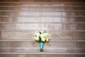 Wedding bouquet of roses on a granite steps Royalty Free Stock Photo