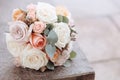 Wedding bouquet of roses on a stone surface Royalty Free Stock Photo