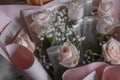 Wedding bouquet in shades of dusty rose, white, green, beige and pink