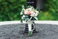 Wedding bouquet in a stone circle under vintage street lamp Royalty Free Stock Photo