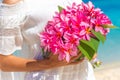 Wedding bouquet from tropical flowers in bride's hans on n Royalty Free Stock Photo