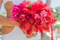 Wedding bouquet from tropical flowers in bride's hans on n Royalty Free Stock Photo