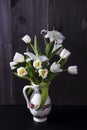 The Wedding bouquet of tulips with lily in a jug on a black background Royalty Free Stock Photo