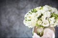 Wedding bouquet in a vase with white roses under the water drops on the mirror against grey and blue background. Royalty Free Stock Photo