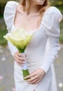 Wedding bouquet of white calla in the hands of the bride Royalty Free Stock Photo