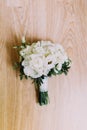 The wedding bouquet of white peonis on the wooden floor. Royalty Free Stock Photo