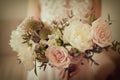 Wedding bouquet of white peony and coffee roses. Lots of greenery. Royalty Free Stock Photo