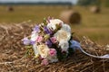 Wedding bouquet of white and pink flowers on a stack of hay Royalty Free Stock Photo