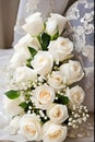 Wedding bouquet of white roses and brides shoes.