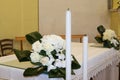 wedding bouquet of white roses on the light table of the church Royalty Free Stock Photo