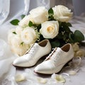 Wedding bouquet of white roses and white wedding shoes.