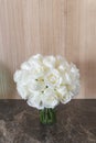 Wedding bouquet, wooden wall background, cristal vase