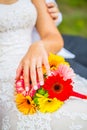 Wedding bouquet with bride hand with ring