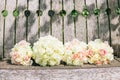 Wedding bouquets lined up on rustic wood background Royalty Free Stock Photo