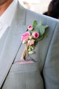 Wedding boutonniere on grey suit of the groom Royalty Free Stock Photo