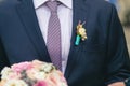 Wedding boutonniere on suit