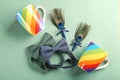 Wedding boutonnieres with peacock feather, colorful cups
