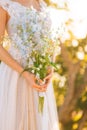 Wedding bridal bouquet of blue Delphinium in the hands of the br Royalty Free Stock Photo