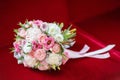 Wedding bridal bouquet on red background, close-up Royalty Free Stock Photo