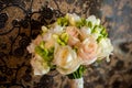 Wedding bridal bouquet of roses. Beautiful bunch of creamy flowers and green buds tightly bound together. Close-up Royalty Free Stock Photo