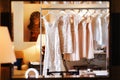 Wedding and bridesmaids dresses hanging on a metal hanger