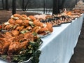 Wedding buffet table with food. Burgers, chicken, fast food side dishes