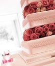 Wedding cake with red and pink roses Royalty Free Stock Photo