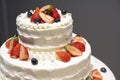 Wedding cake with cute strawberries and blueberries