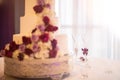 Wedding Cake and Champagne Table with the Focus on the Glasses