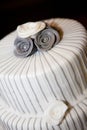 Wedding cake close up with decorative flowers on top