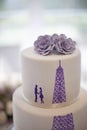 Wedding cake close-up with silhouette of a couple and the Eiffel Tower