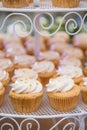 Wedding cake by cupcakes for celebration Royalty Free Stock Photo