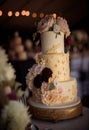 Wedding cake decorated with a beautiful gold decor of cream. Royalty Free Stock Photo