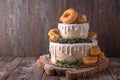 Wedding cake decorated with donuts and wild berries. Royalty Free Stock Photo