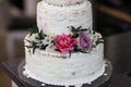 Wedding cake decorated with fresh flowers Royalty Free Stock Photo