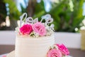 Wedding cake decorated with rose flowers. High quality photo. Royalty Free Stock Photo