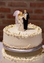 Wedding cake with groom and bride Royalty Free Stock Photo