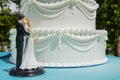 The wedding cake with little bride and groom Royalty Free Stock Photo