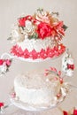 Wedding cake with red flowers. Royalty Free Stock Photo