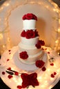 Wedding cake with red roses Royalty Free Stock Photo